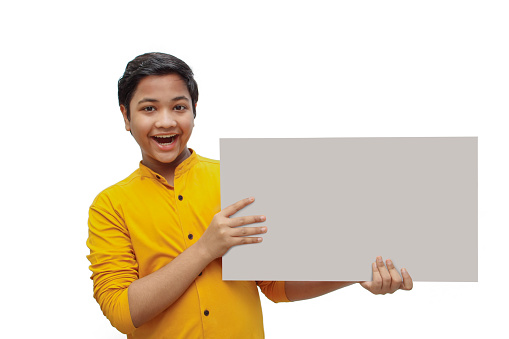 Closeup portrait a boy is hold white board and happy