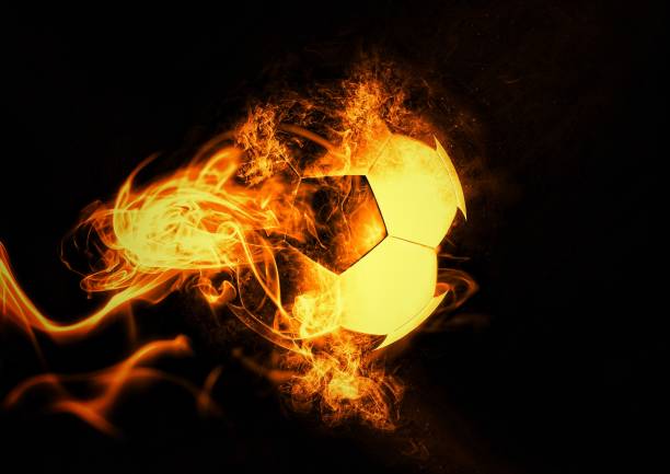 istock 3D rendering soccer ball wrapped in flames 1255546588