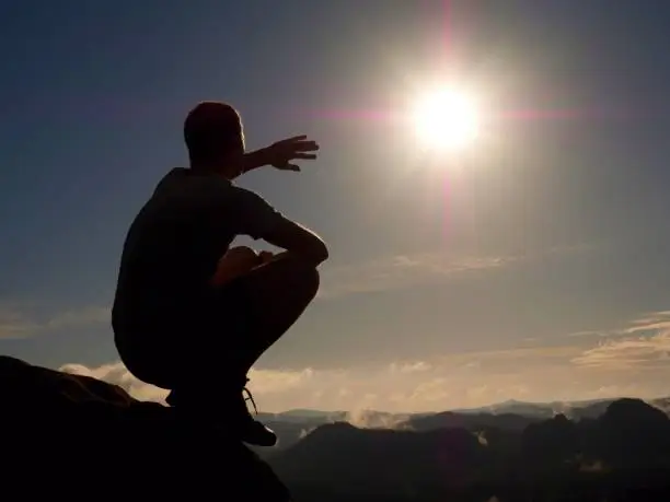 Photo of Freedom Hiker Sit Upper The Misty Valley And Enjoy Morning In Beautiful Nature