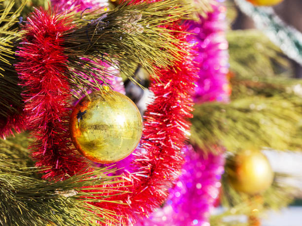istock Authentic pine branch decorated with Christmas old baubles, selective soft focus as a background for a Christmas design. 1255549677