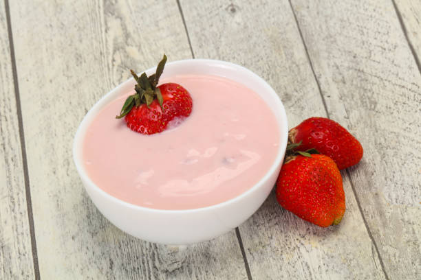 istock Yoghurt with strawberry in the bowl 1255550901