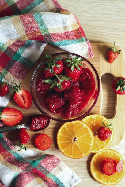 Food art. Tasty composition with strawberry and jam. Sweet summer taste