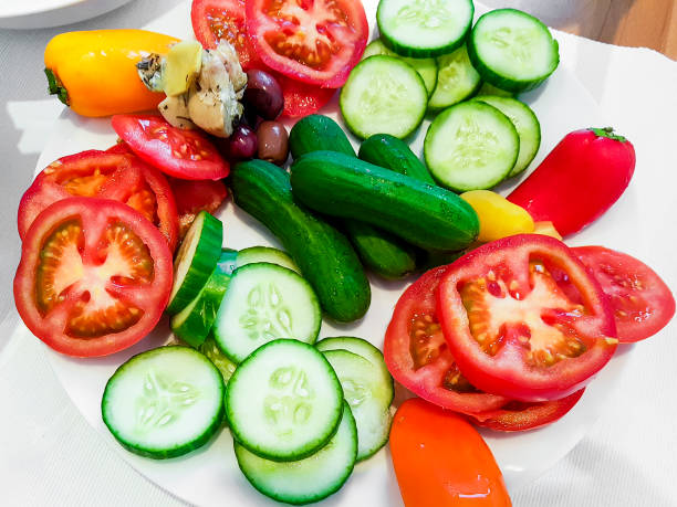 Colorful vegetables cut and served on a plate. Breakfast healthy.