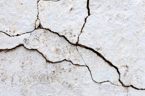 istock Abstract concrete, weathered with cracks and scratches. Landscape style. Grungy Concrete Surface. Great background or texture. 1255554028