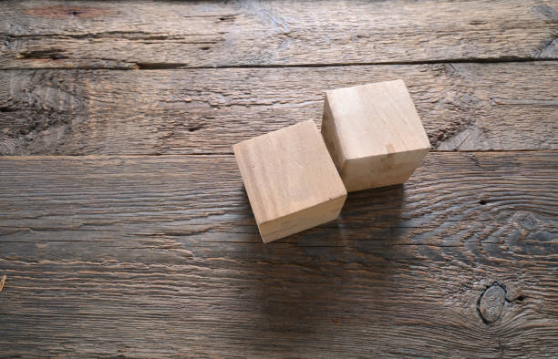 istock Two empty wooden cubes mockup for your signs. Template with a copy space. 1255560473