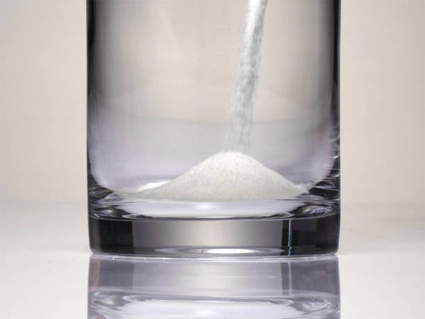 istock pour powder into a glass. 1255564320