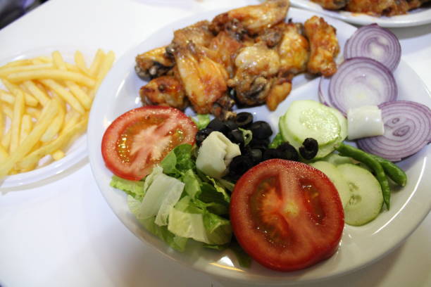 istock Roasted chicken with green salad ready to eat 1255566849