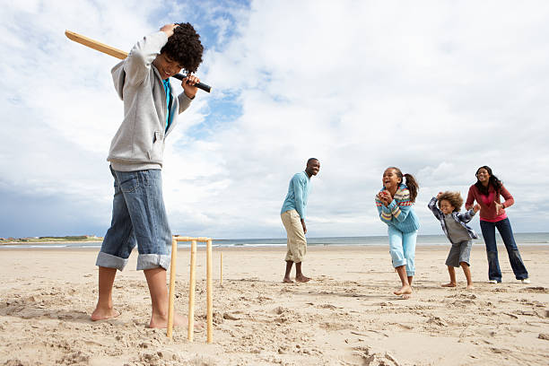 istock Family playing cricket on beach 125556719