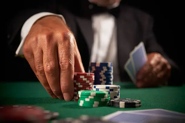 Photo of card player gambling in casino