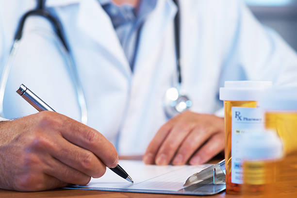 Doctor with RX prescription drug stock photo