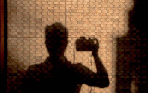 istock shadow of photographer reflected on wall 1255570676