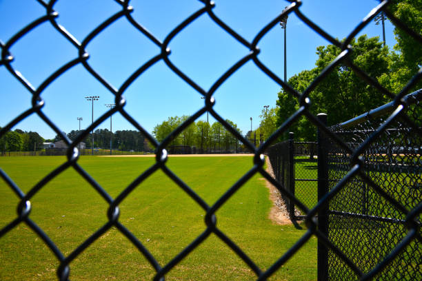 istock Empty Baseball Field Closed during Coronavirus Pandemic 1255570896