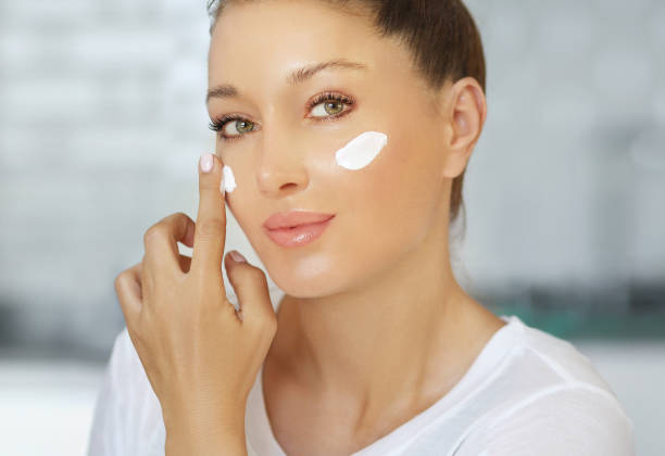 istock Magic anti-aging cream.Applying the cream 1255572328