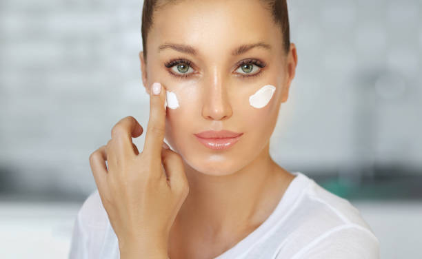 istock Magic anti-aging cream.Applying the cream 1255572335