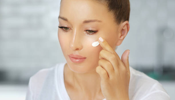 istock Magic anti-aging cream.Applying the cream 1255572340