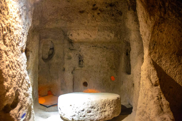 istock Ancient Mill Stone - Public. Underground city. Derinkuyu is an ancient multi-storey underground cave city in Cappadocia. Turkey / Cappadocia 1255572435
