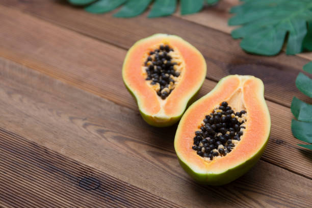 istock Papaya fruit over wooden background. Exotic sweet fruit. Copy space. 1255574237