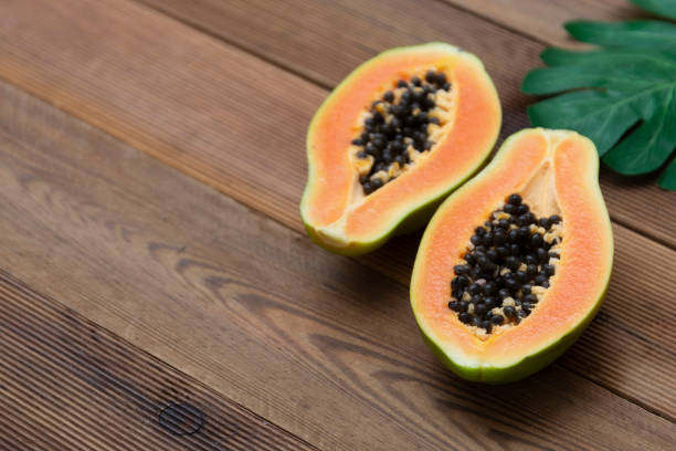 istock Papaya fruit over wooden background. Exotic sweet fruit. Copy space. 1255574268