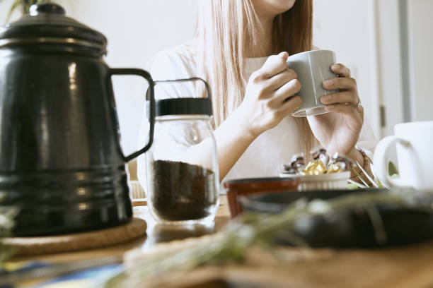 istock woman enjoying a home cafe 1255574736