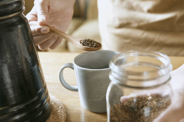 woman enjoying a home cafe woman enjoying a home cafe instant coffee stock pictures, royalty-free photos & images