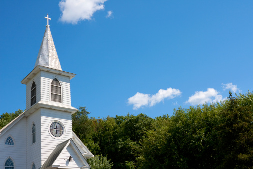 White community church against blue sky