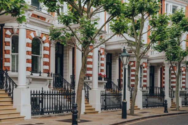 Traditional Victorian houses with stoops in Kensington and Chelsea, London, UK. stock photo