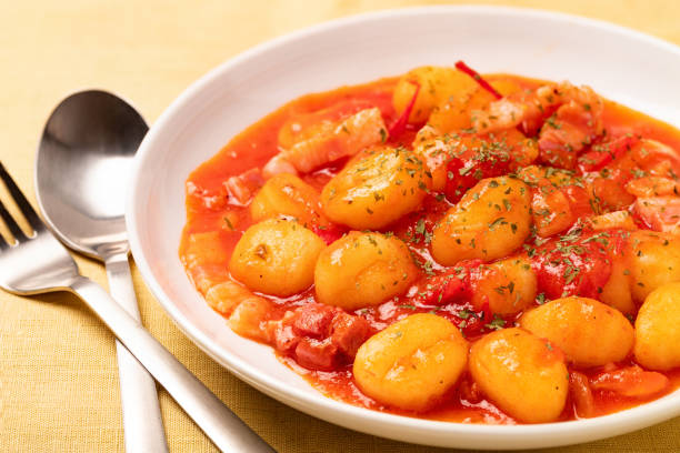 istock Gnocchi with tomato sauce in a white plate 1255578212