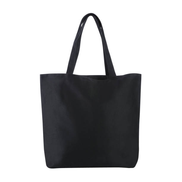 istock Blank tote bag mock up, isolated on white background, Front view. Empty black cotton tote bag template for shopping. Clear canvas tote bag for grocery. 1255579704