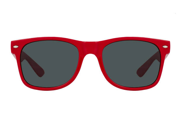 istock Sunglasses with a red plastic frame and black lenses isolated on white background. 1255581514