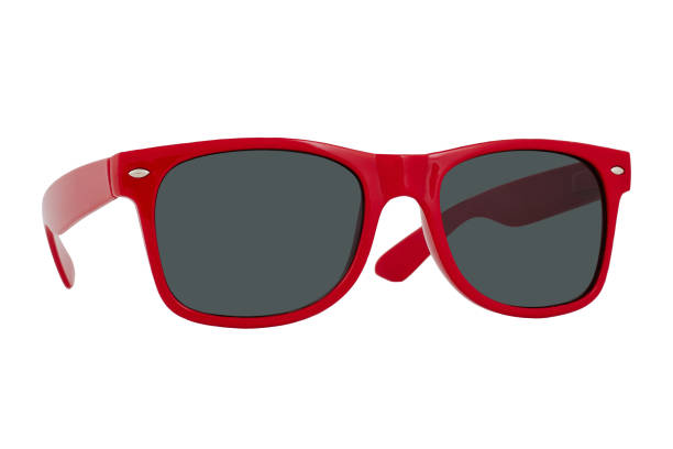 istock Sunglasses with a red plastic frame and black lenses isolated on white background. 1255581525