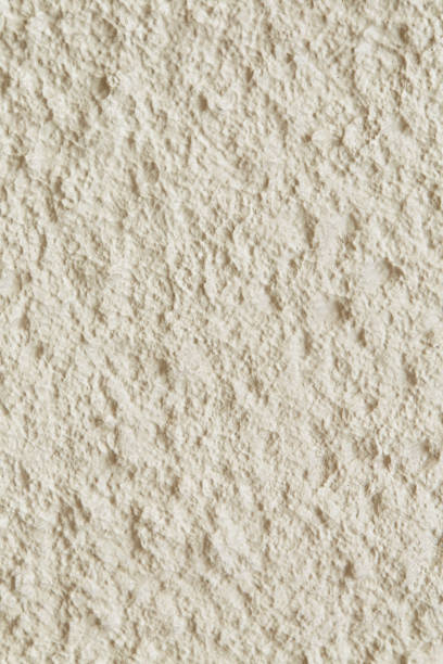 istock Cream color textured walls, home buildings 1255581847
