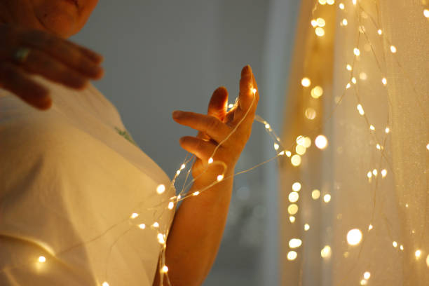 istock Women decorating wedding room with lights. 1255588298