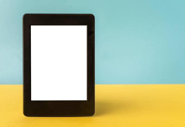 A modern black electronic book with a white blank empty screen on yellow background with empty space
