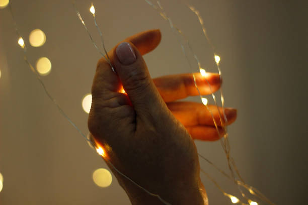 istock Women decorating wedding room with lights. 1255588482
