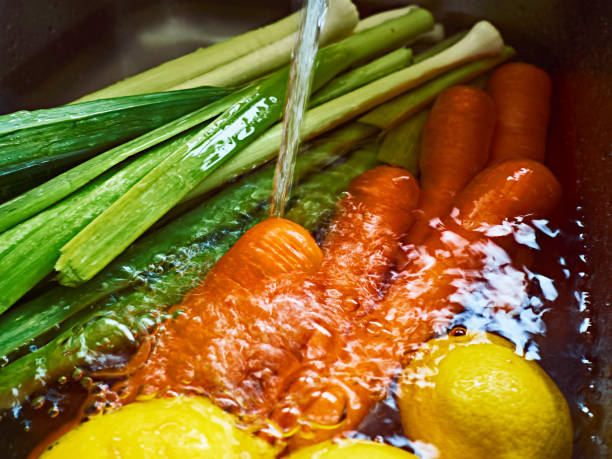 istock Fresh carrot, leek and lemon in water. 1255588504