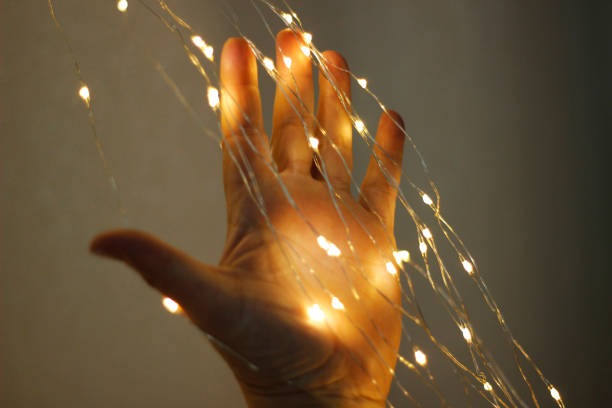 istock Women decorating wedding room with lights. 1255588526