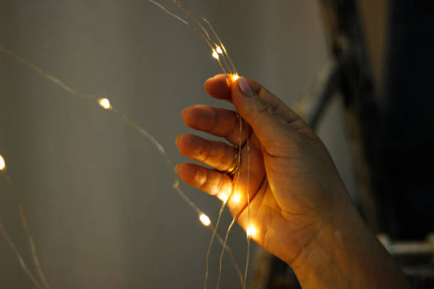 istock Women decorating wedding room with lights. 1255588715