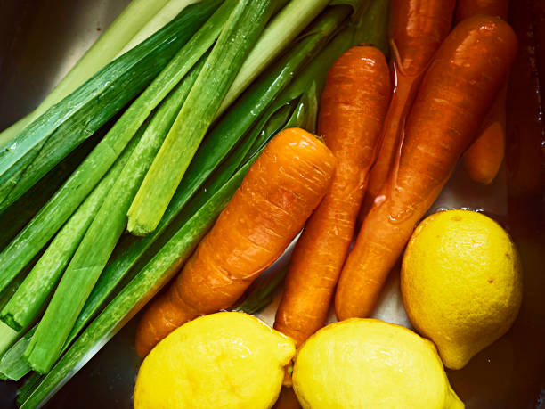 istock Fresh carrot, leek and lemon in water. 1255588722