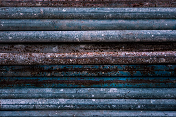 istock Stack of old rusty aged metal iron plumbing pipes. Background. Texture 1255589632
