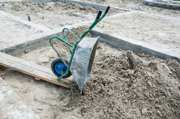 istock Construction trolley on the site with concrete and sand. 1255589935