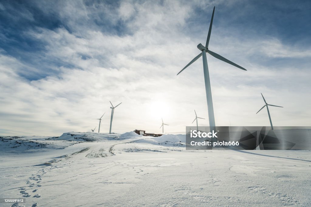 Eolic turbines for wind power industry: technicians doing maintenance Wind Turbine Stock Photo