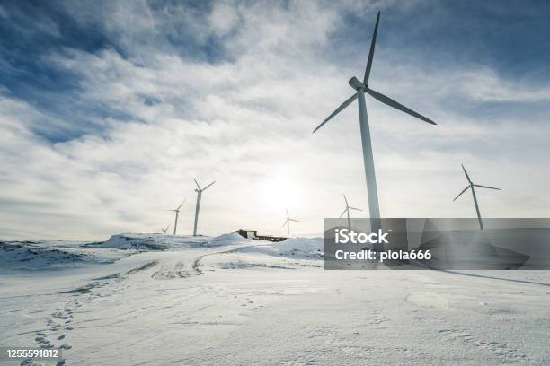 Eolic Turbines For Wind Power Industry Technicians Doing Maintenance Stock Photo - Download Image Now