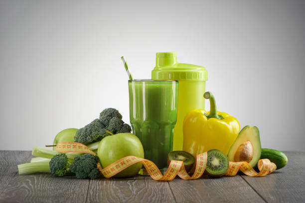 istock Broccoli, avocado, apple,pepper, celery, cucumber, kiwi, shaker and smoothie 1255592920