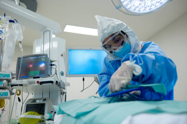 istock Anesthesiologist during surgery in COVID protective workear. 1255593097