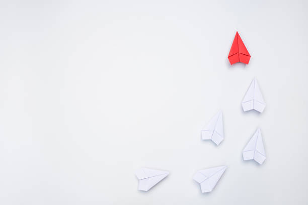 Leadership concept with red paper plane leading, copy space