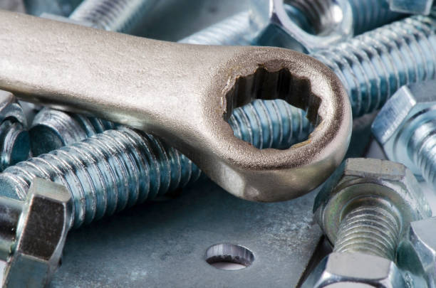 istock Metal bolts and nuts. Tools for working and fixing. Macrophotography. 1255597449