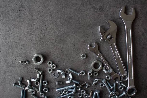 istock Industrial frame made of bolts and nuts 1255598450