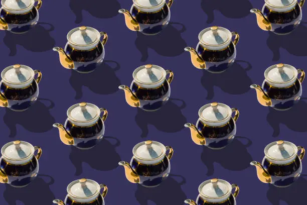 Background from large group of old ceramic teapots. 
Flat lay, top view. Diagonal isometric view.