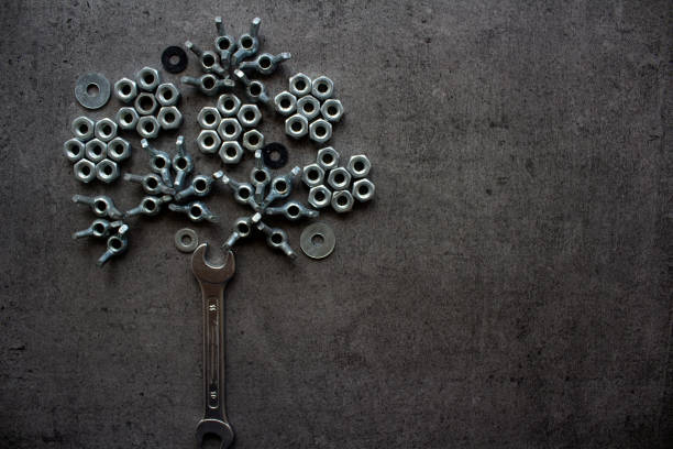 istock Tree made of old bolts and nuts. Industrial style. 1255601575