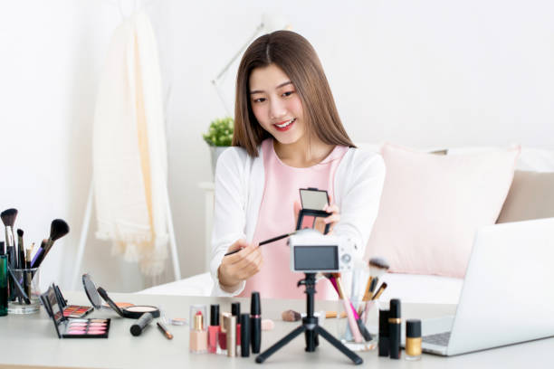 istock Beautiful Asian beauty vlogger doing product review live broadcasting 1255604802